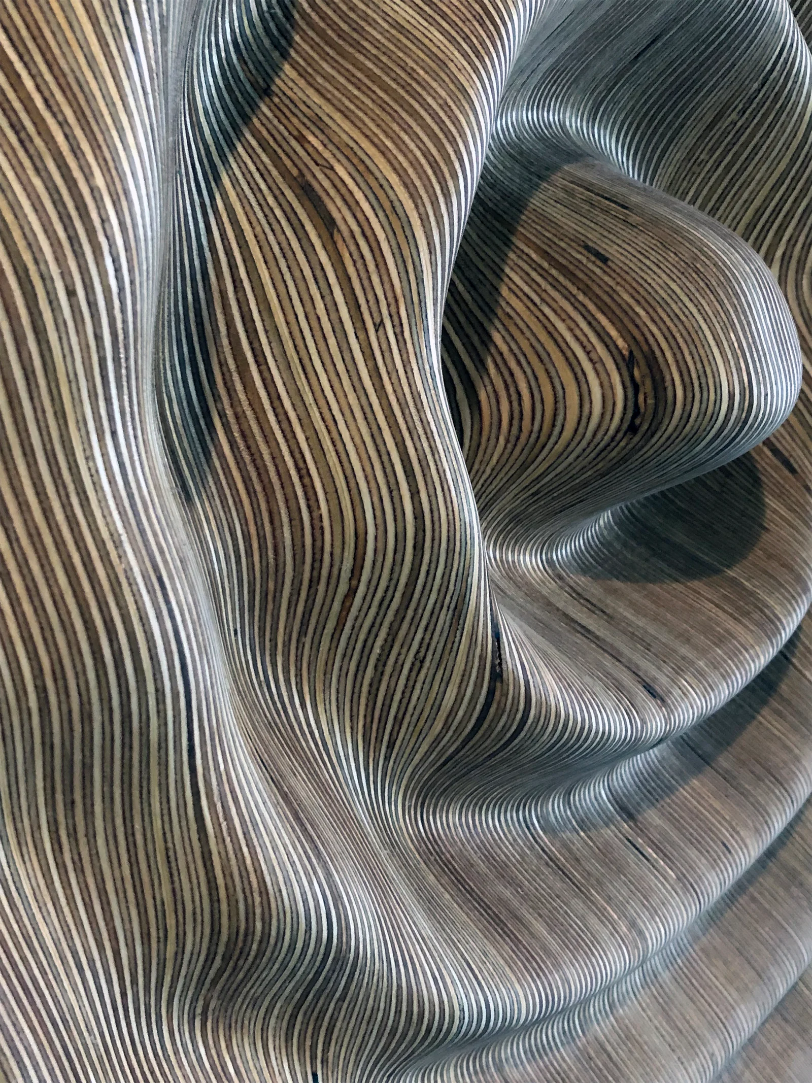 Close-up of the finished surface, the layers reading as contour lines